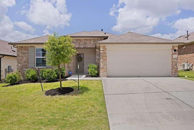 19825 Abigail Fillmore Rd, Manor, TX 78653 - view of front of home featuring brick siding, a garage, driveway, and a front lawn