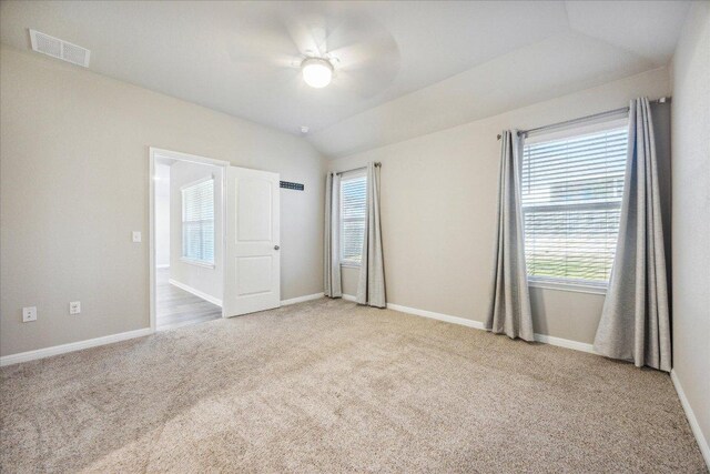 329 Empress Tree Dr, Leander, TX 78641 - carpeted spare room featuring healthy amount of natural light, vaulted ceiling, and ceiling fan