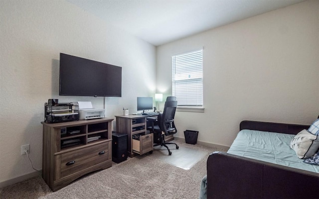 4701 Tully Dr, Pflugerville, TX 78660 - bedroom featuring an office area, light carpet, and baseboards