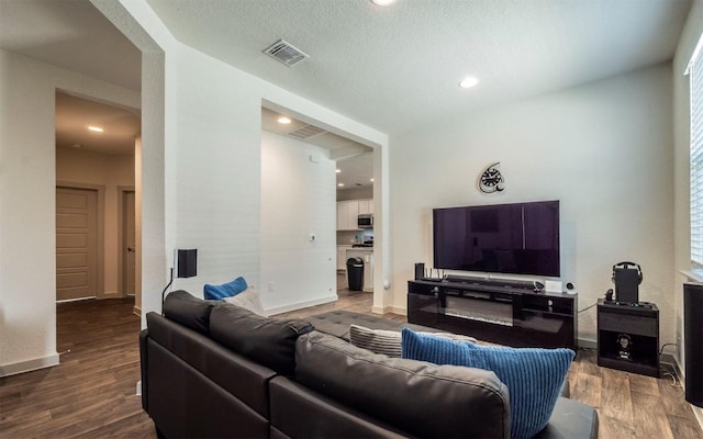 4701 Tully Dr, Pflugerville, TX 78660 - living room featuring wood finished floors, baseboards, and recessed lighting