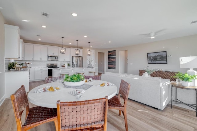 17112 Vernal Rd, Manor, TX 78653 - dining space featuring light wood finished floors, recessed lighting, and a ceiling fan