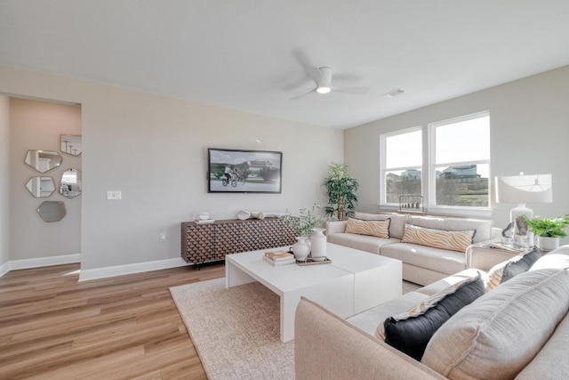 17112 Vernal Rd, Manor, TX 78653 - living room featuring light wood-type flooring, ceiling fan, and baseboards