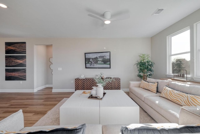 17112 Vernal Rd, Manor, TX 78653 - living room with light wood-style floors, a ceiling fan, and baseboards
