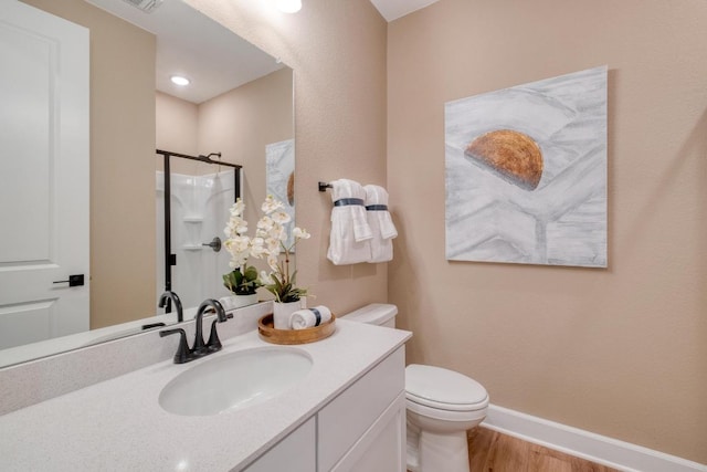 17112 Vernal Rd, Manor, TX 78653 - bathroom featuring toilet, wood finished floors, vanity, a shower, and baseboards