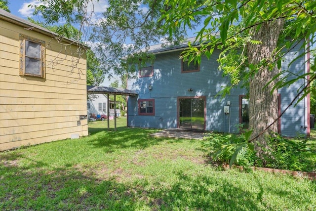808 N 10th St, Temple, TX 76501 - back of house featuring a lawn