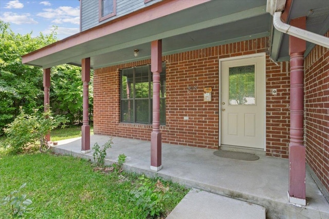808 N 10th St, Temple, TX 76501 - doorway to property with brick siding and a porch