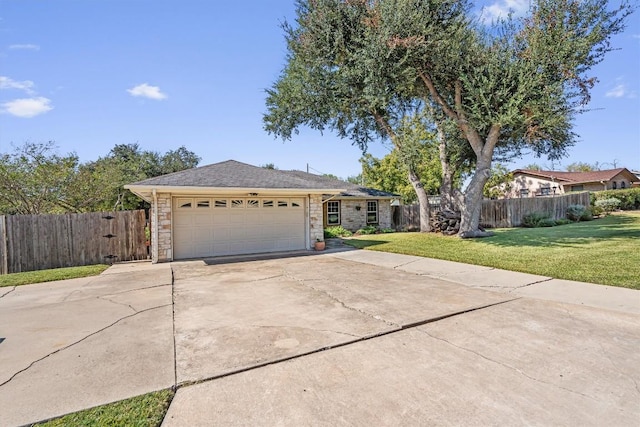 2201 Carolyn Dr, Taylor, TX 76574 - single story home with stone siding, a garage, and driveway