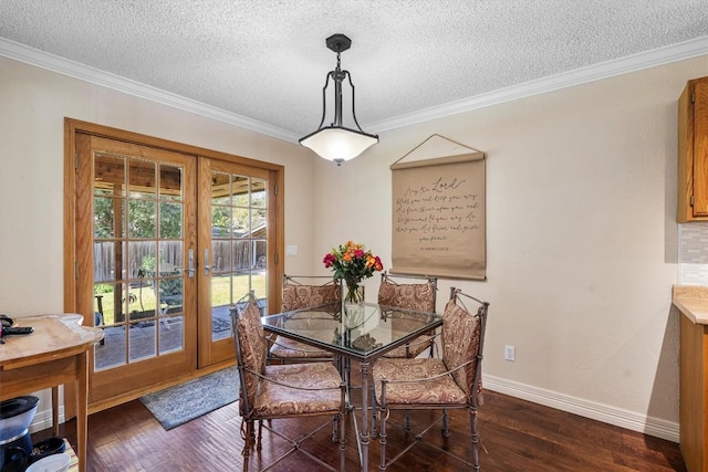 2201 Carolyn Dr, Taylor, TX 76574 - dining area with crown molding, a textured ceiling, and dark wood-style flooring