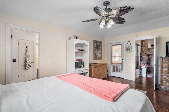 2201 Carolyn Dr, Taylor, TX 76574 - bedroom with dark wood-style flooring, a textured ceiling, ceiling fan, and a closet