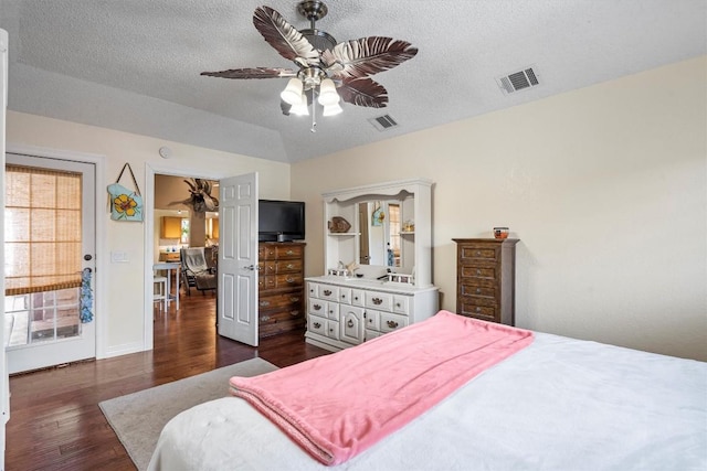 2201 Carolyn Dr, Taylor, TX 76574 - bedroom with dark wood finished floors, a textured ceiling, and ceiling fan
