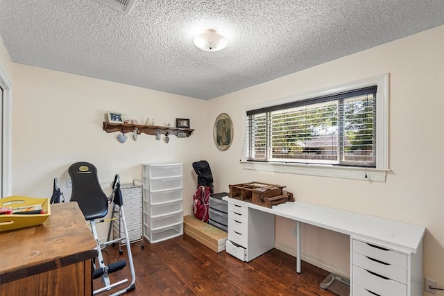 2201 Carolyn Dr, Taylor, TX 76574 - office area with dark wood-style floors and a textured ceiling