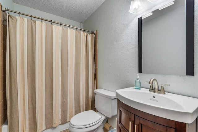 2201 Carolyn Dr, Taylor, TX 76574 - bathroom with a textured ceiling, a textured wall, and vanity