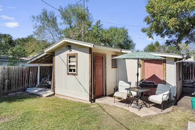 2201 Carolyn Dr, Taylor, TX 76574 - view of outdoor structure with a fenced backyard