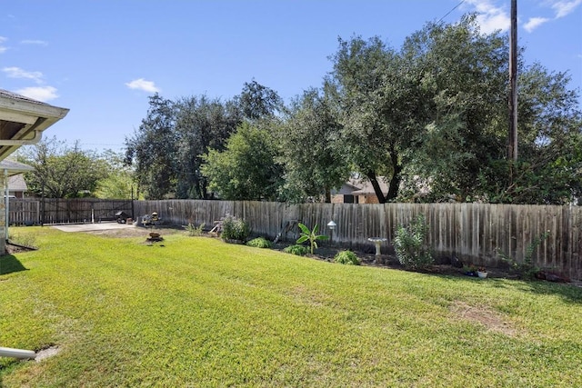 2201 Carolyn Dr, Taylor, TX 76574 - fenced backyard featuring a patio area