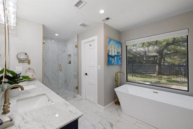 105 Palos Verdes Dr, Lakeway, TX 78734 - full bath with double vanity, a marble finish shower, marble finish floors, a freestanding bath, and recessed lighting