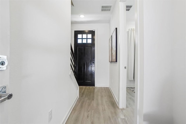 2624 Metcalfe Rd Unit 17, Austin, TX 78741 - entryway with baseboards, light wood-style floors, and recessed lighting