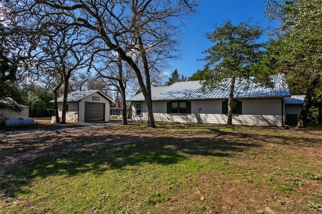 11092 Riley Green Rds Unit 121, Franklin, TX 77856 - view of grassy yard with a garage, an outbuilding, and driveway