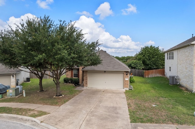 10304 Lone Pine Ln, Austin, TX 78747 - view of front of house with brick siding, central AC, a garage, and concrete driveway