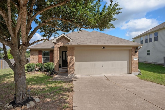 10304 Lone Pine Ln, Austin, TX 78747 - ranch-style house featuring brick siding, driveway, a garage, and a shingled roof