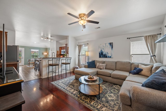 10304 Lone Pine Ln, Austin, TX 78747 - living room featuring a ceiling fan, healthy amount of natural light, dark wood-type flooring, and rail lighting