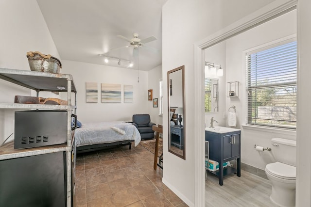 9300 N Madrone Trl, Austin, TX 78737 - bedroom with ceiling fan and track lighting
