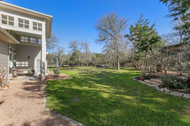 9300 N Madrone Trl, Austin, TX 78737 - view of green lawn with a patio