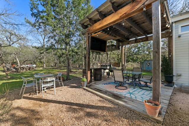 9300 N Madrone Trl, Austin, TX 78737 - view of patio with outdoor dining area and a storage shed