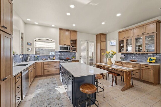 9300 N Madrone Trl, Austin, TX 78737 - kitchen featuring appliances with stainless steel finishes, open shelves, decorative backsplash, and recessed lighting