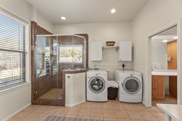 9300 N Madrone Trl, Austin, TX 78737 - laundry room with washer and dryer, cabinet space, light tile patterned flooring, and recessed lighting