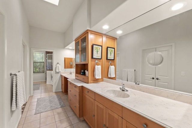 9300 N Madrone Trl, Austin, TX 78737 - full bath with vanity, tile patterned floors, a garden tub, and recessed lighting