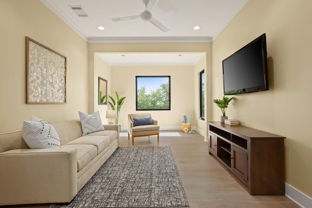 1405 Parkinson Dr, Austin, TX 78704 - living room with ornamental molding, light wood finished floors, ceiling fan, baseboards, and recessed lighting