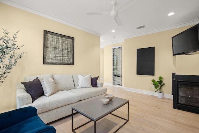 1405 Parkinson Dr, Austin, TX 78704 - living room with crown molding, a ceiling fan, light wood-style flooring, recessed lighting, and baseboards