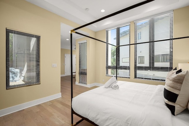 1405 Parkinson Dr, Austin, TX 78704 - bedroom featuring wood finished floors, baseboards, and recessed lighting