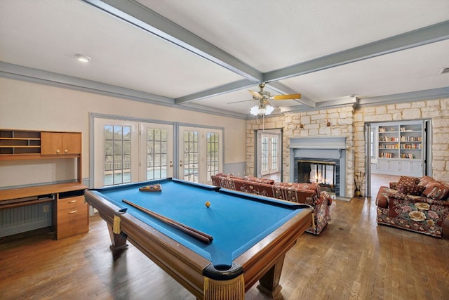27846 Natural Bridge Caverns Rd, San Antonio, TX 78266 - recreation room with beamed ceiling, wood finished floors, a fireplace, ceiling fan, and billiards