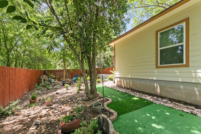 810 Monterrey St, Lockhart, TX 78644 - fenced backyard with an area to practice putting