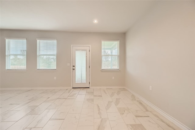2009 Jacey Way, Austin, TX 78725 - empty room with baseboards, recessed lighting, and light marble finish floors