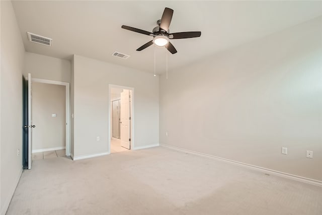 2009 Jacey Way, Austin, TX 78725 - unfurnished bedroom featuring baseboards, light carpet, a ceiling fan, and ensuite bathroom