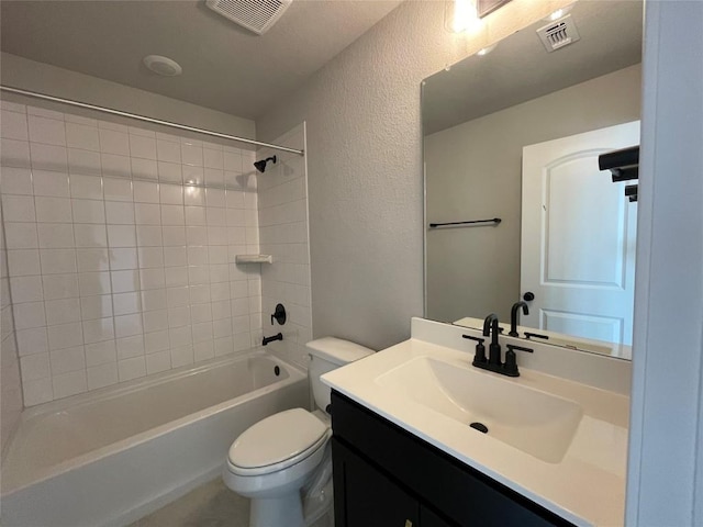 2460 Walking Y Rd, Georgetown, TX 78633 - bathroom featuring toilet, vanity, a textured wall, and washtub / shower combination