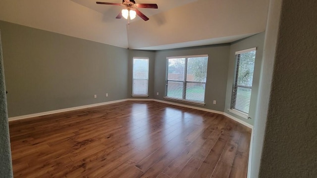 1002 Boxwood Loop, Georgetown, TX 78628 - unfurnished room featuring wood finished floors, a ceiling fan, vaulted ceiling, and baseboards