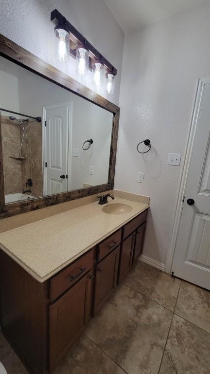 1002 Boxwood Loop, Georgetown, TX 78628 - full bathroom with vanity and tile patterned flooring