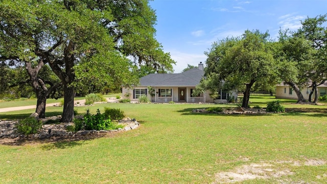 14717 Crosscreek Dr, Austin, TX 78737 - view of front of property with a front lawn, a chimney, and a porch