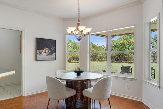 14717 Crosscreek Dr, Austin, TX 78737 - dining space with crown molding, wood finished floors, a chandelier, and baseboards