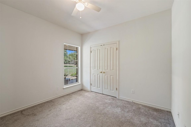 14717 Crosscreek Dr, Austin, TX 78737 - unfurnished bedroom featuring carpet floors, baseboards, a closet, and ceiling fan