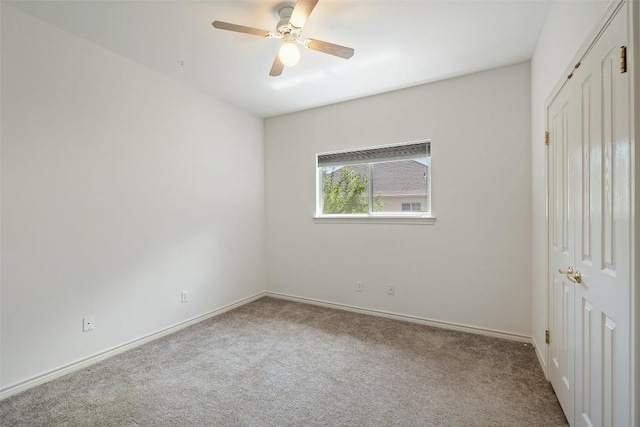 14717 Crosscreek Dr, Austin, TX 78737 - unfurnished bedroom featuring carpet, baseboards, a closet, and a ceiling fan