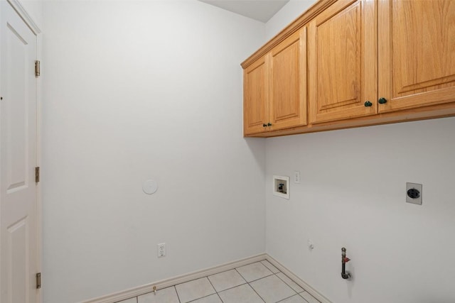14717 Crosscreek Dr, Austin, TX 78737 - laundry area with hookup for a gas dryer, washer hookup, cabinet space, light tile patterned flooring, and hookup for an electric dryer