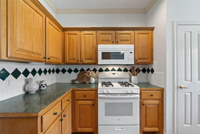 14717 Crosscreek Dr, Austin, TX 78737 - kitchen with white appliances, dark countertops, backsplash, brown cabinetry, and crown molding