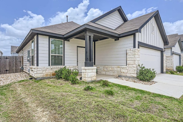1521 W Kerr Pass, Leander, TX 78641 - view of front of home featuring stone siding, board and batten siding, and a shingled roof