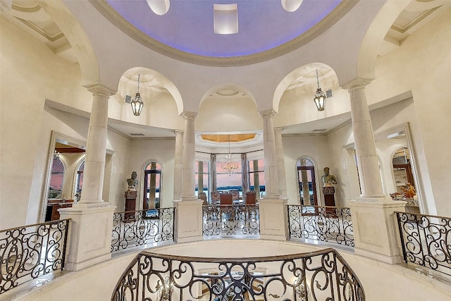 12821 Park Dr, Austin, TX 78732 - foyer entrance featuring a towering ceiling, ornamental molding, and ornate columns