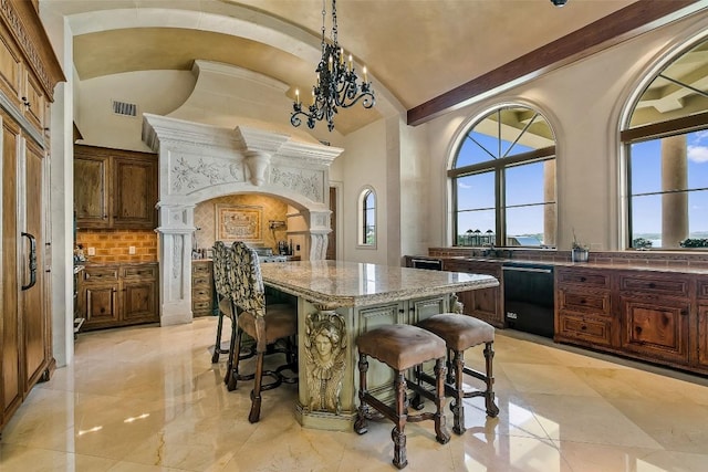 12821 Park Dr, Austin, TX 78732 - kitchen featuring dishwasher, arched walkways, a center island, a breakfast bar, and lofted ceiling