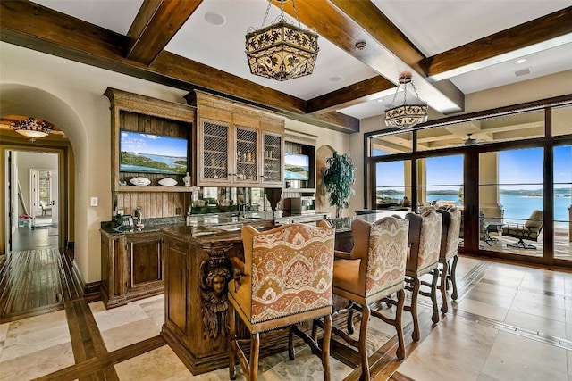 12821 Park Dr, Austin, TX 78732 - bar featuring inlaid floor details, beamed ceiling, a chandelier, pendant lighting, and coffered ceiling